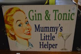 A novelty metal gin and tonic sign.