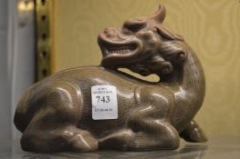 Chinese celadon glazed model of a dragon.