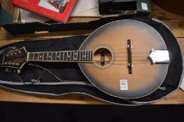 A flat back mandolin with bag.