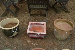 Three large garden pots.