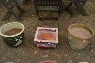 Three large garden pots.