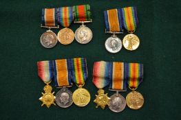 A group of various miniature medals.