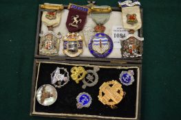 A quantity of enamel and other badges.
