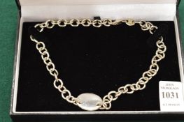 A sterling silver chain link necklace.