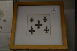 A group of five small bronze crucifixes, framed and glazed.