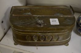 An embossed brass lidded box.