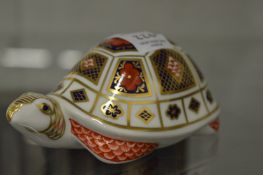 A Royal Crown Derby model of a tortoise.