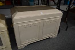 A grey painted coffer or storage box.