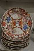 A set of eight Japanese porcelain plates.