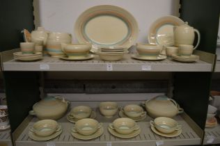 A large quantity of Susie Cooper pastel banded dinnerware.