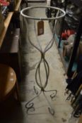 A wrought iron plant pot stand.