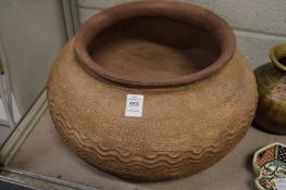 An unusual large African moulded terracotta bowl.
