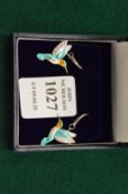 A pair of sterling silver and enamel humming bird earrings.