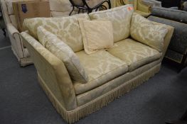A classical style cream upholstered two seater settee.