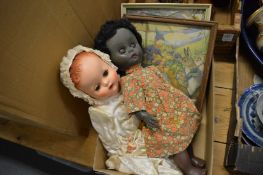 Two dolls and two nursery pictures.