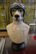 An amusing resin bust of a dog wearing crash helmet and goggles.