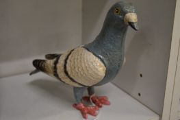 Painted cast iron model of a pigeon.