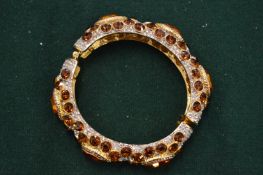 A Kenneth Lane gem set bracelet.
