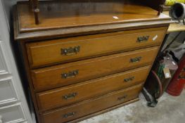 A chest of four long drawers.