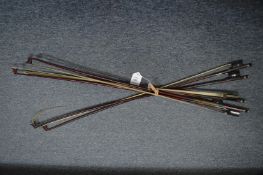 A quantity of violin bows.