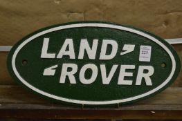 A cast iron Land Rover sign.