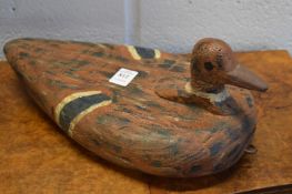 A carved and painted wood decoy.