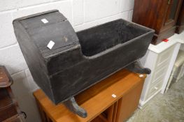 A stained pine crib.