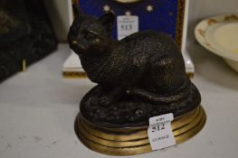 Cast bronze model of a seated cat.