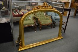 A Victorian style gilt framed over-mantel mirror.