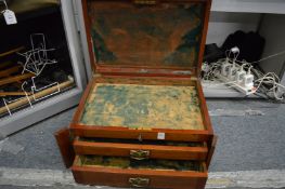 A mahogany cutlery canteen.