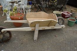 A wooden wheelbarrow.