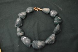 A decorative chunky bead necklace.