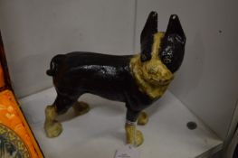 A cast iron dog door stop.