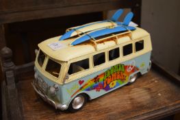 A novelty tin plated flower power surfers van.
