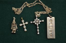 A silver ingot pendant, two crucifixes and a silver charm.