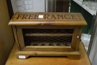 A wooden egg cage.