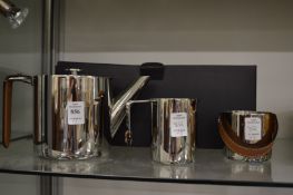 A Ralph Lauren three piece stainless steel tea set with original box.