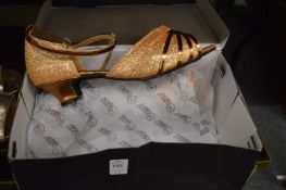 A pair of ladies glittery shoes size 7, another pair of ladies shoes size 6 ½ and a pair of boots