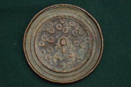 A Chinese bronze mirror.
