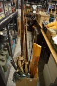 Various fishing rods and landing net.
