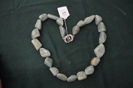 A decorative chunky bead necklace.