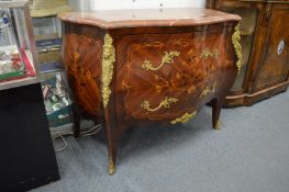 A good French design Bombay marquetry commode with rouge marble top and ormolu mounts.