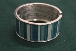 A silver and enamel cuff style bracelet.
