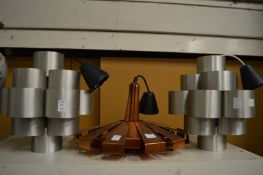 A pair of stylish ceiling lights and another.