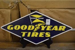 A cast iron Goodyear Tyres sign.