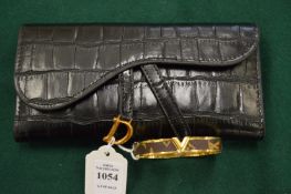 A purse and a bangle.