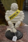 Cast iron Michelin man on a swivel base.