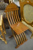 A good pair of Syrian inlaid hardwood folding chairs.