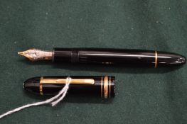 A Mont Blanc fountain pen, the cap with engraved dedication.