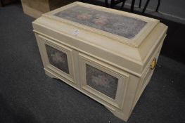 A decoratively painted storage box.